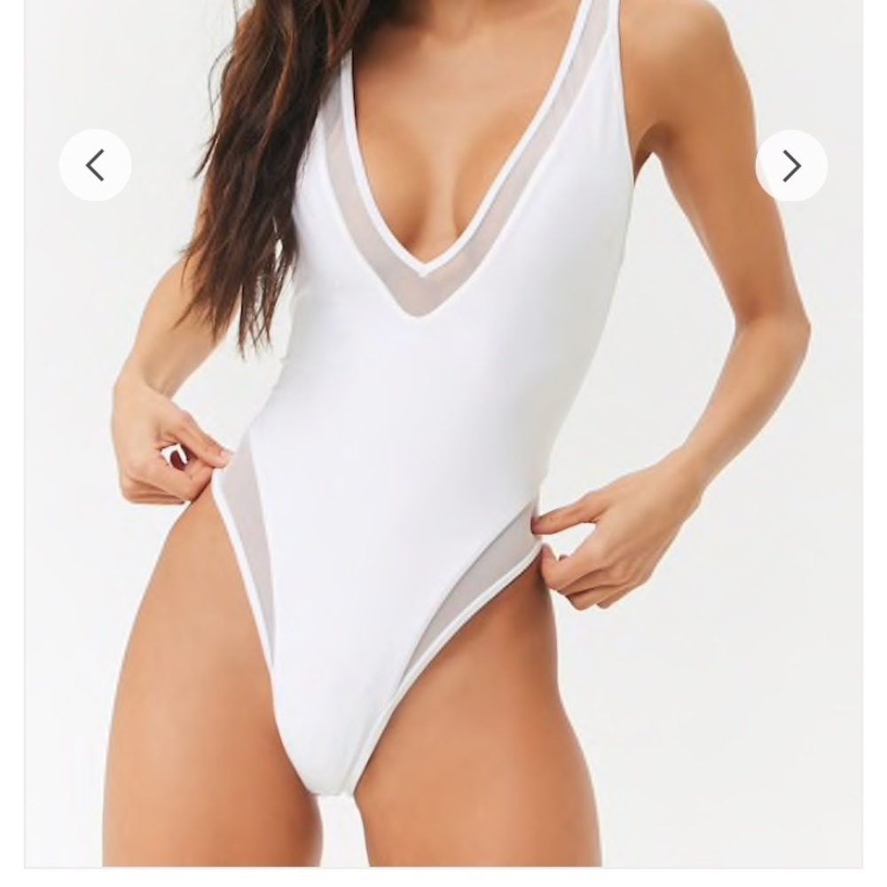 White one- piece with mesh inserts